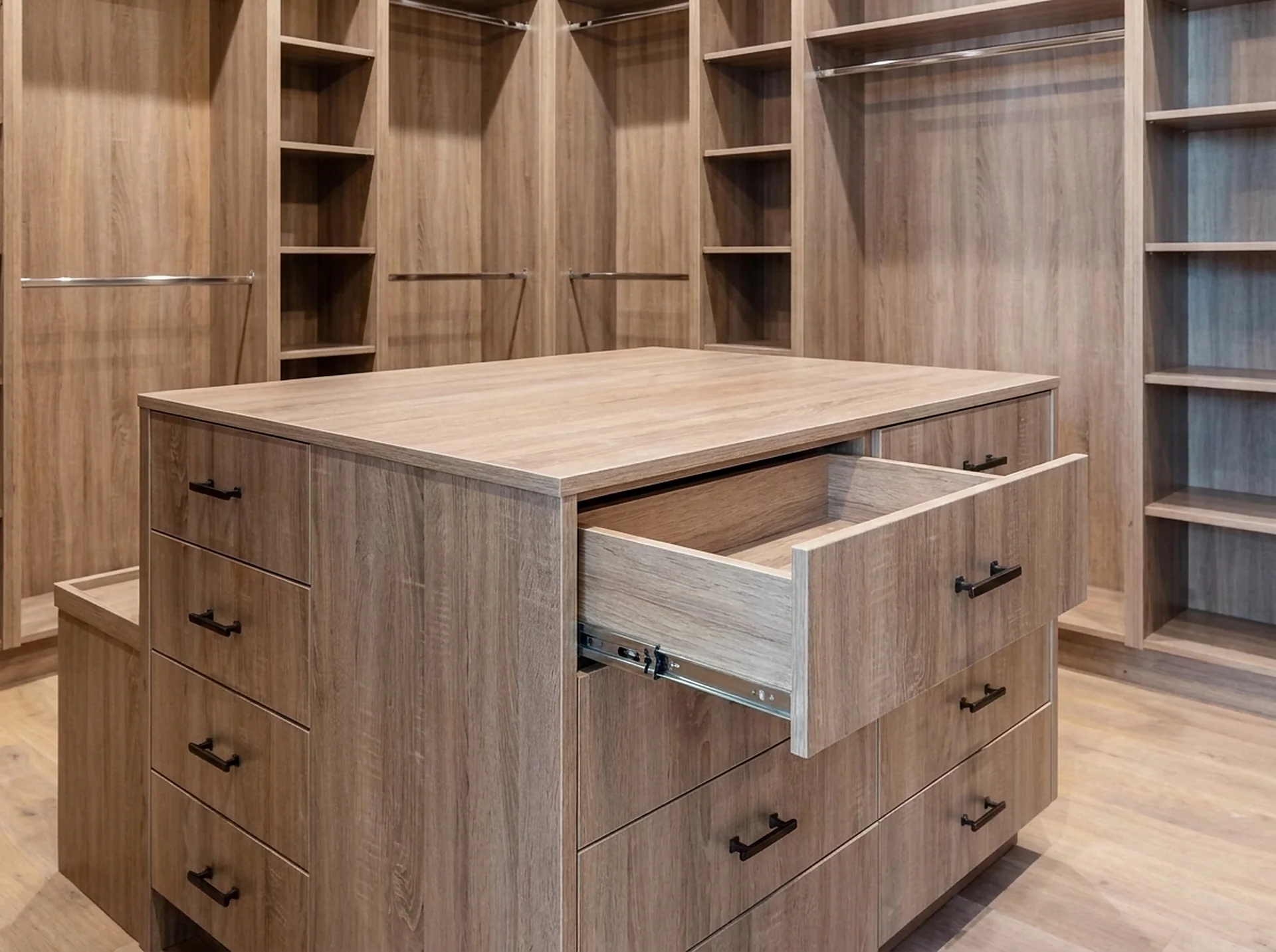 A 60-inch drawer island in Downy Wood Grain — drawer count is the single biggest cost driver after linear feet.