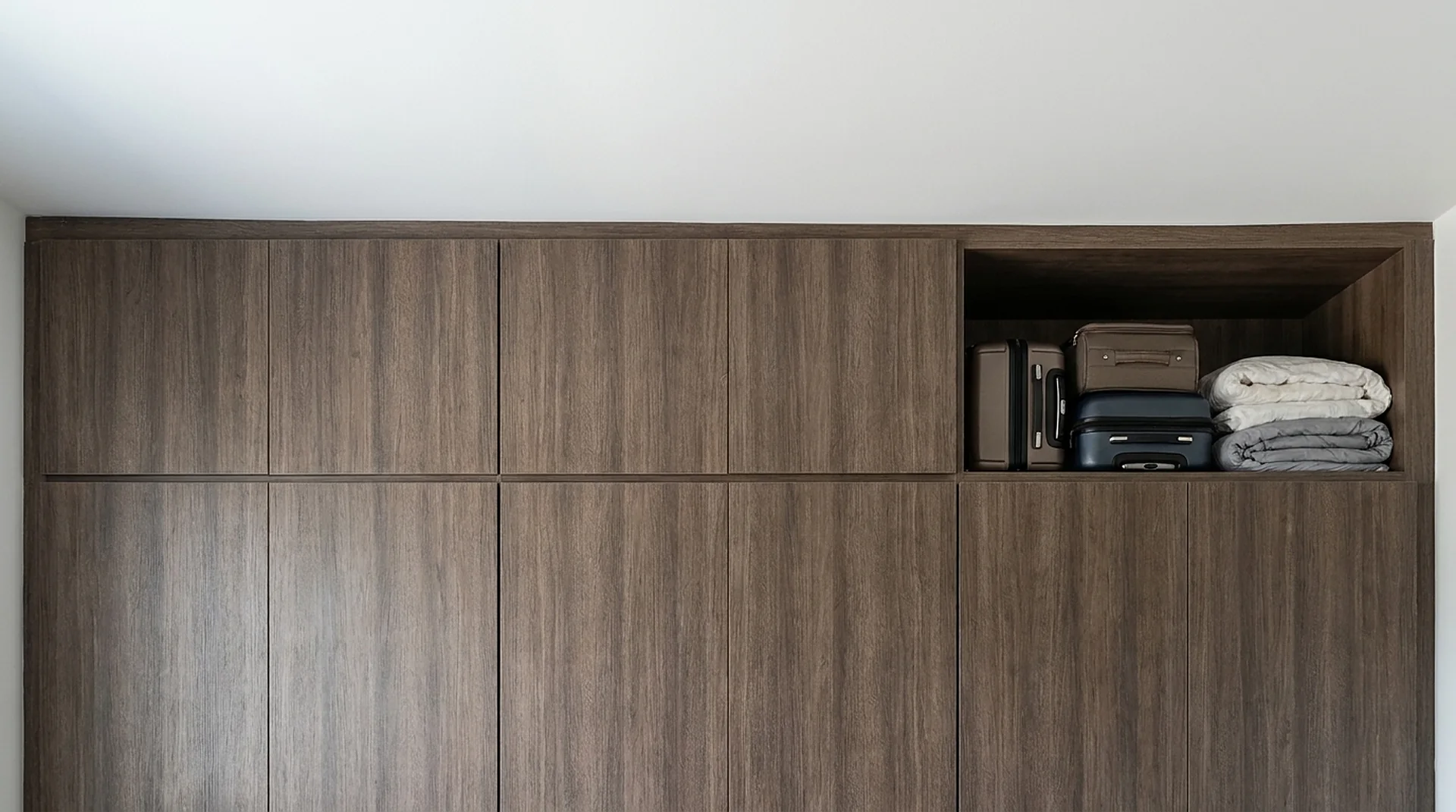 Ceiling cabinets installed above a custom closet run